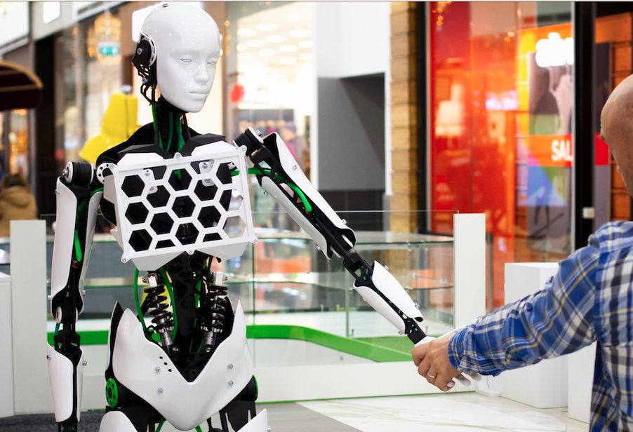 Robot shaking hands with human