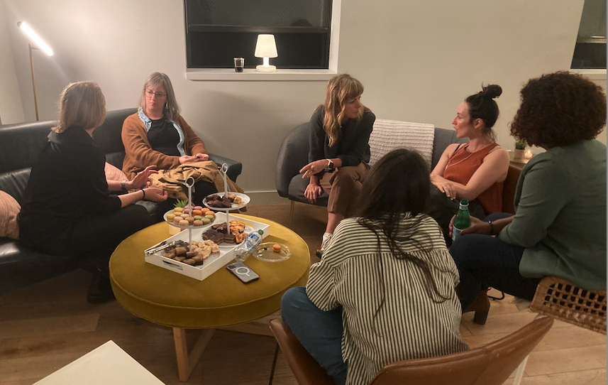 women chatting around a table